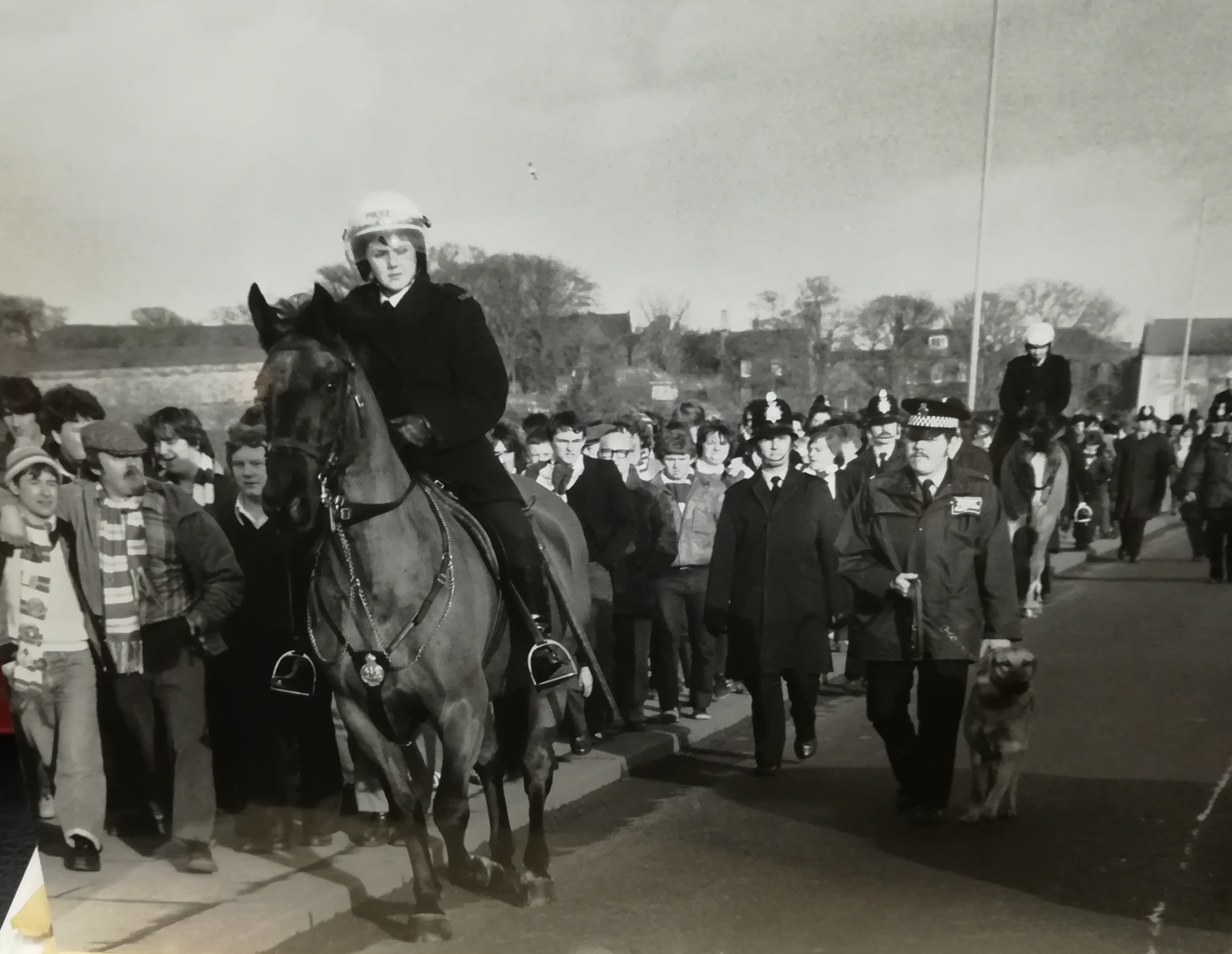 Celtic fans are herded by police in Berwick in 1981