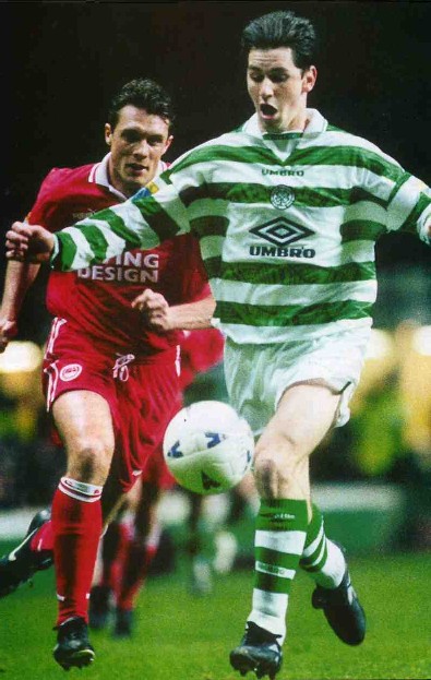 Jackie McNamara races away from Derek Whyte