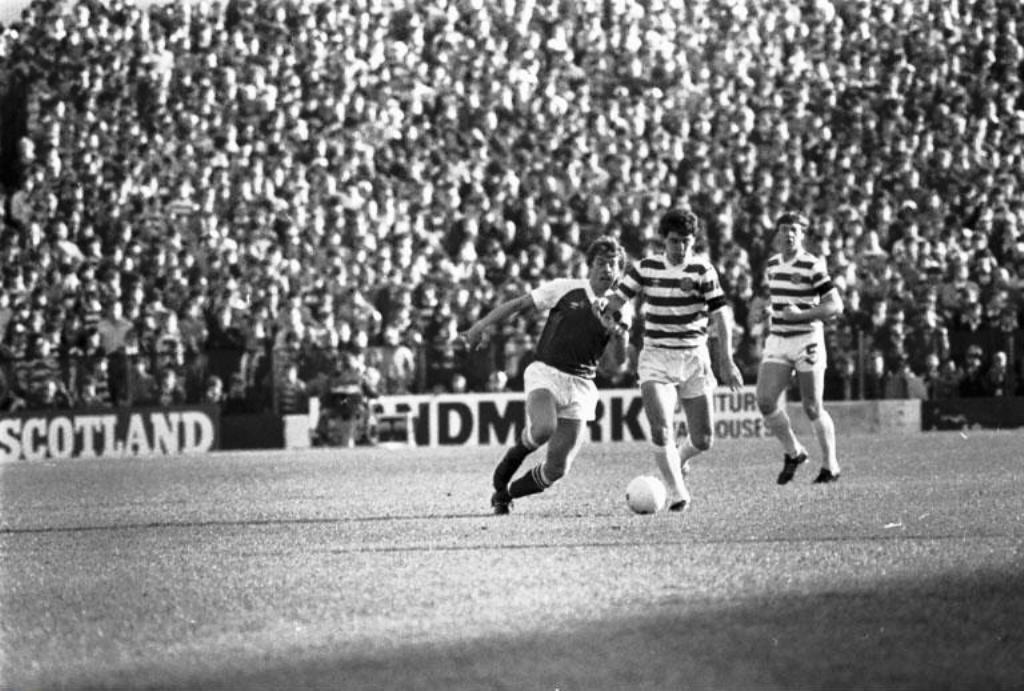 George McCluskey on the run as Willie Garner looks on