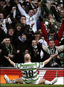 Celtic clinch the SPL title on 5 April, with six games still to play - Hartson scores the winner against Hearts in front of an ecstatic Celtic Park