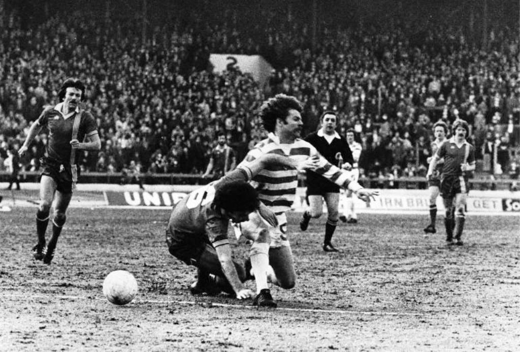 Willie Miller clatters Alfie Conn