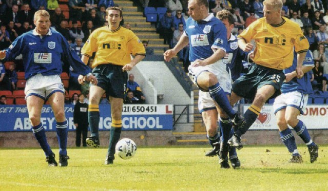 Mjallby tackles Gary Bollan, St Johnstone, May 2000