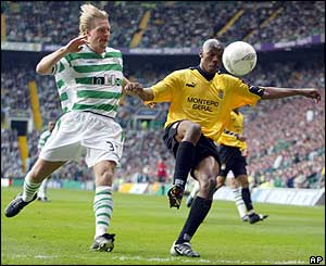 Celtic defender Johan Mjallby tracks the run of Boavista forward Duda during a dull first half 