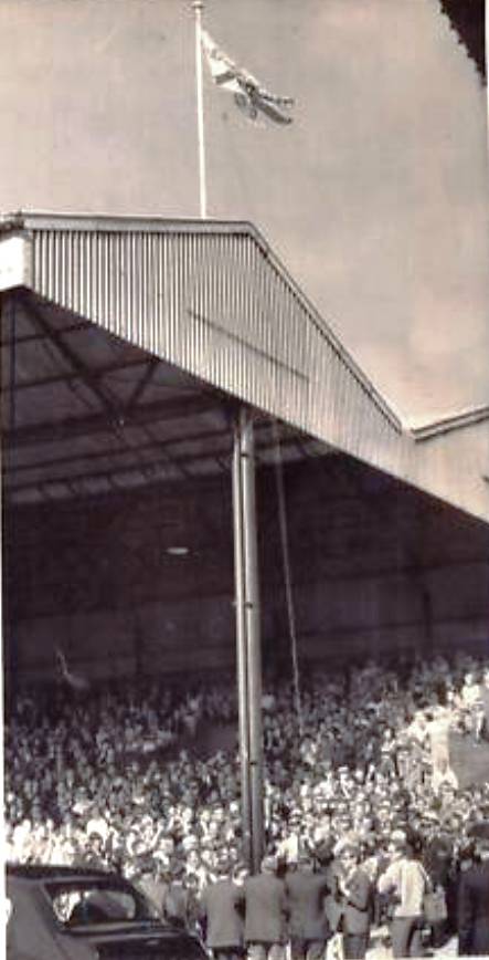 Lady Kelly raises the 1969 league flag